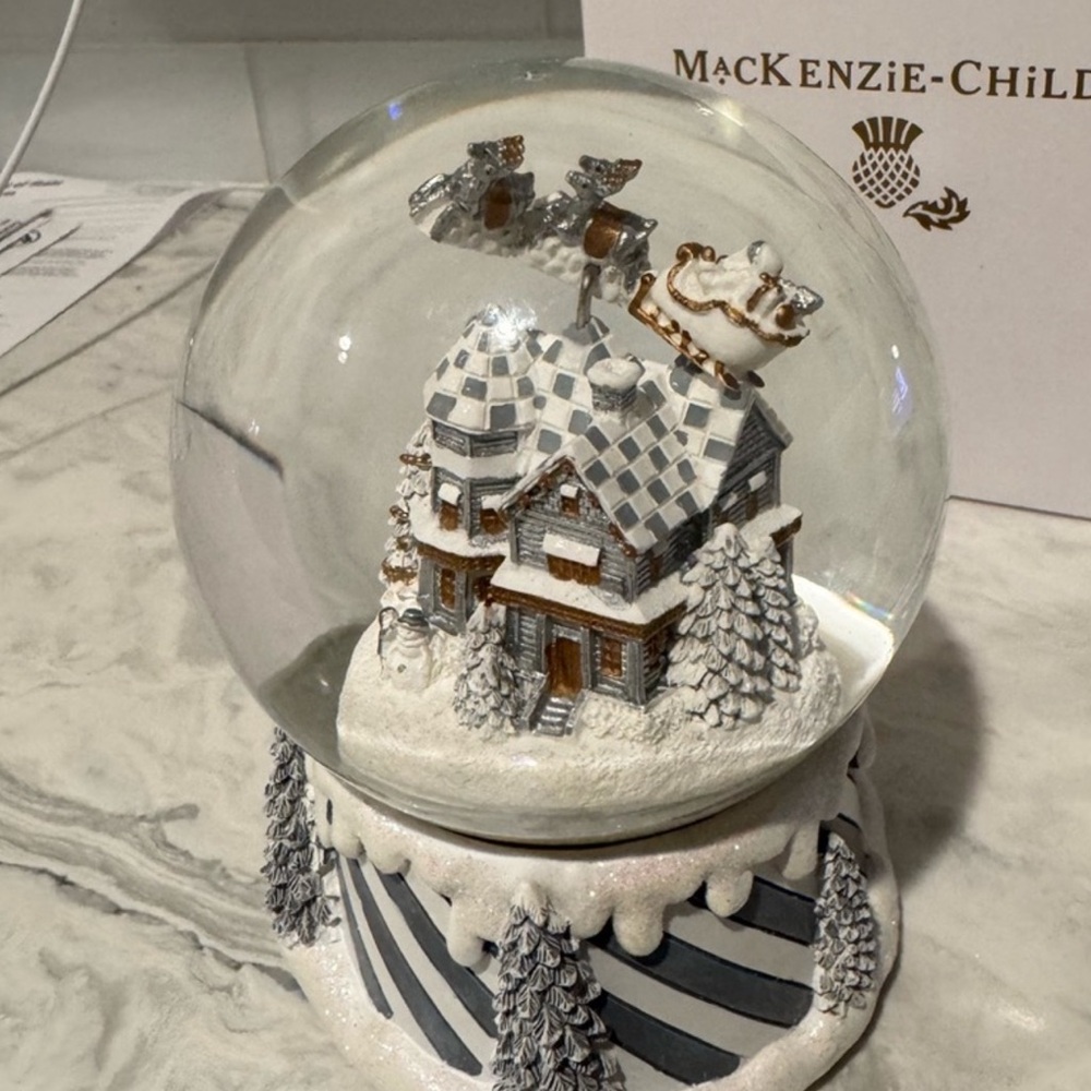 MacKenzie-Childs Sterling Village Holiday Snow Globe with Santa and Reindeer.